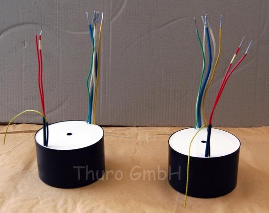 Casted toroidal transformer with HF braid